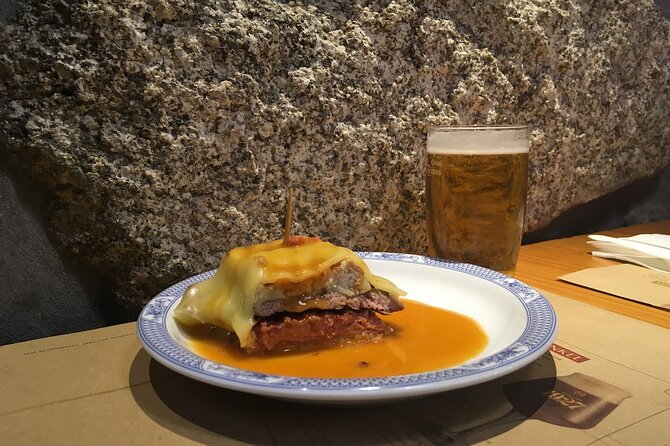 Porto Food Tour of 8 Tastings: Custard Tart, Bifana & Hidden Gems - Clérigos Tower keeps you oriented