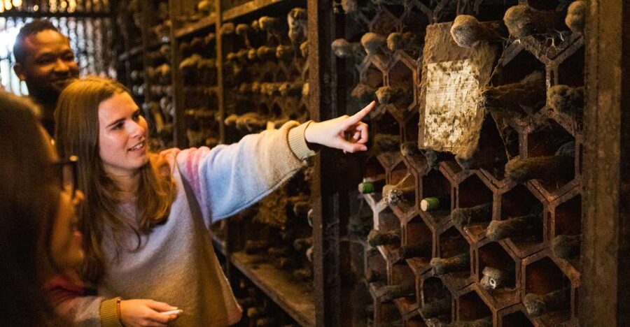 Porto: Food & Wine Tasting Walking Tour with Port Wine Cave - Entering the old Port cellar