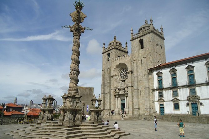 Porto Full Day City Tour Wine Tasting and Six Bridges Cruise - Walking through Porto’s UNESCO-listed center
