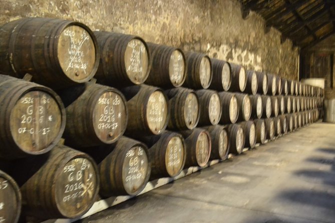 Porto: Port and Douro Wine Walking Tour With 9 Wine Tastings - Stop three: Fonseca and the cellar setting