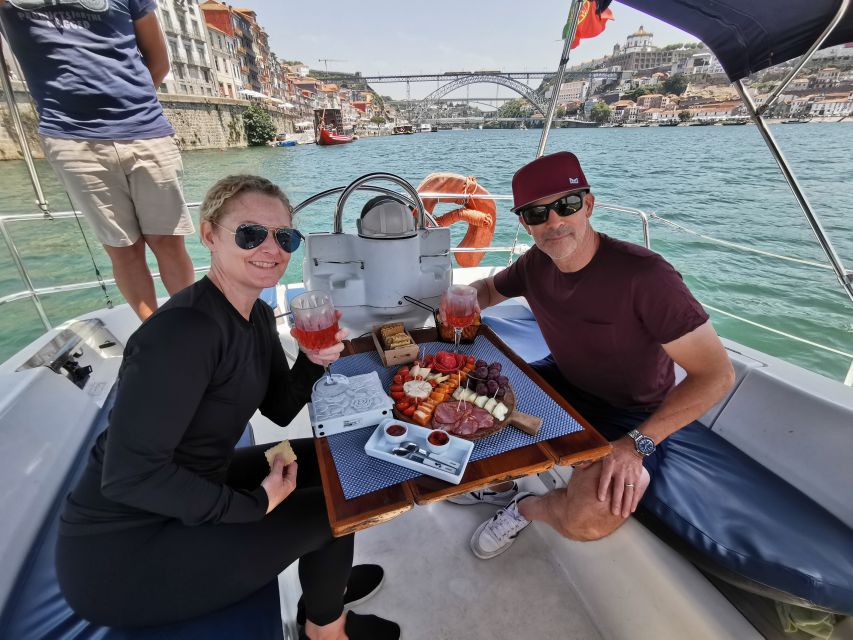 Porto: Private Sailboat Trip with Wine Tasting & Charcuterie - Passing the Arrábida Bridge toward Porto