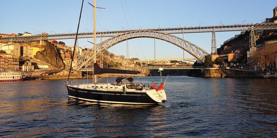 Porto: The Best Douro Boat Tour - Crossing beneath the Dom Luís Bridge
