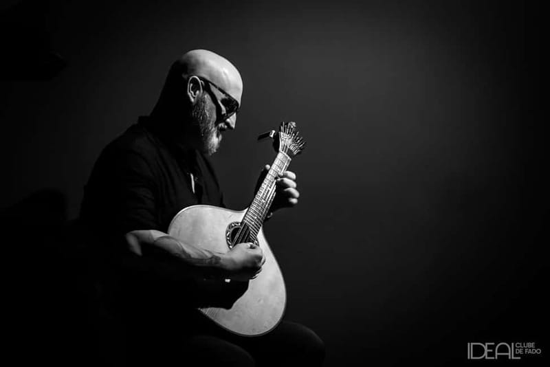 Porto: The highest-rated traditional fado concert (downtown) - Entering Ideal Clube de Fado with a glass of Port