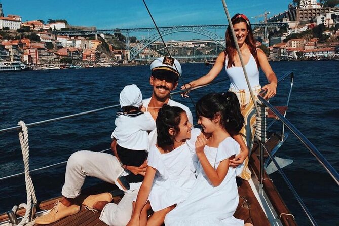 Porto: Tour on the Douro River in a Classic Boat - A welcome drink and a plate with family roots